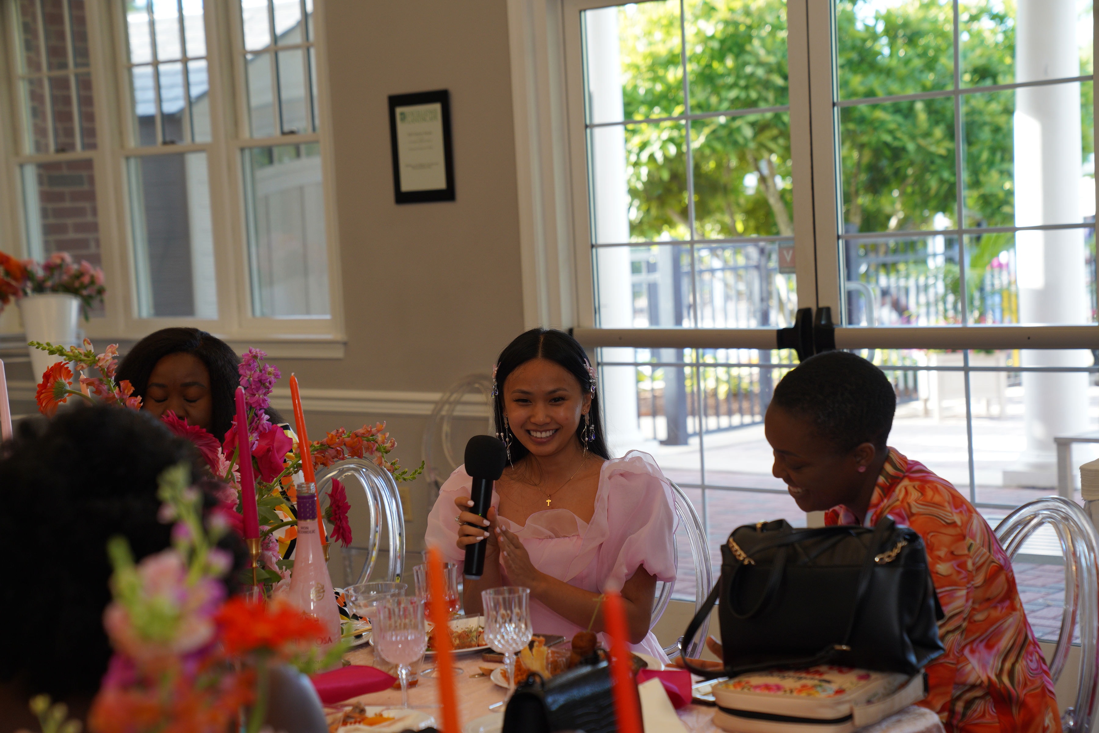 Attendee sharing at the table during the Bloom event
